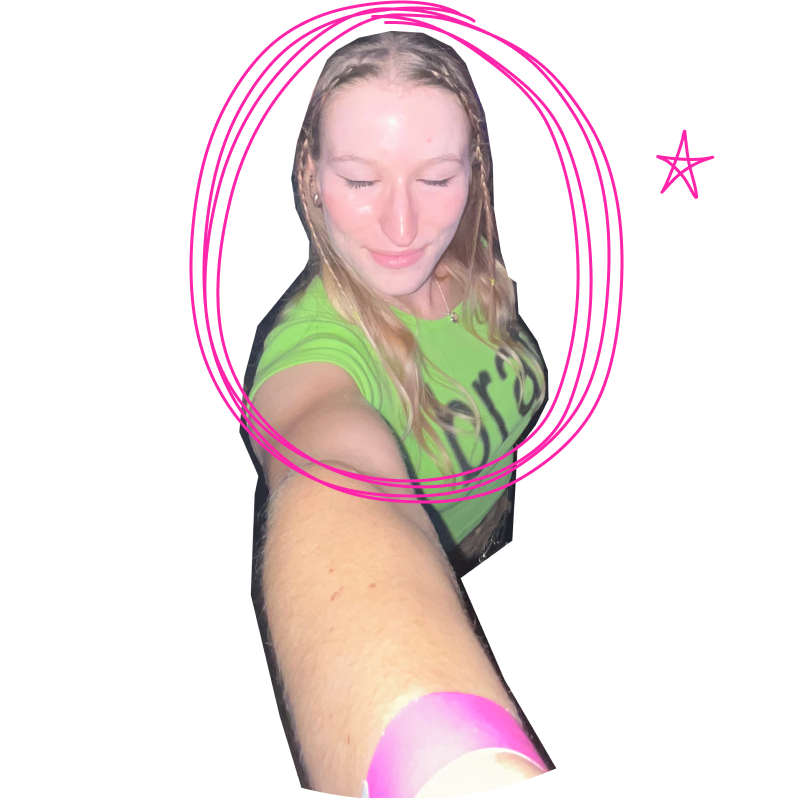 grace takes a selfie with the camera from a high angle. she has her eyes closed and is smiling contently.